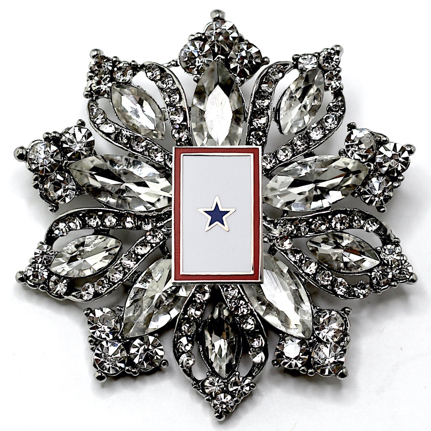 Decorative brooch with star emblem on a white background