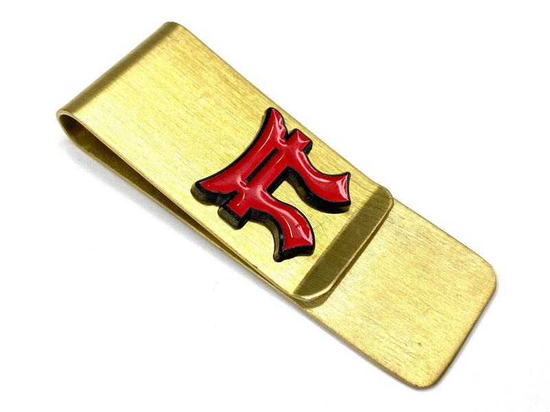 Gold money clip with red torri on a white background