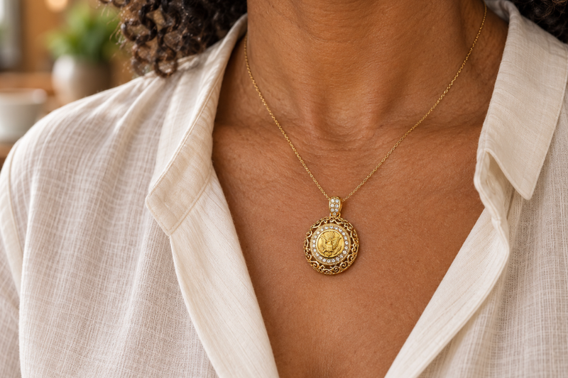 Red poppy charm on a silver chain on a white background