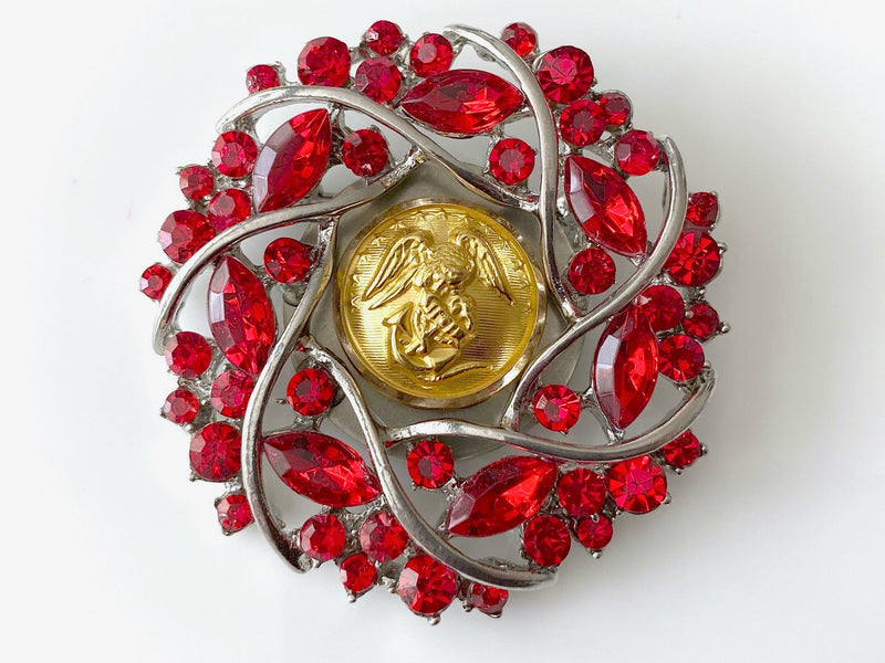 Red and Silver Brooch with a Marine Corps Button center on a white background