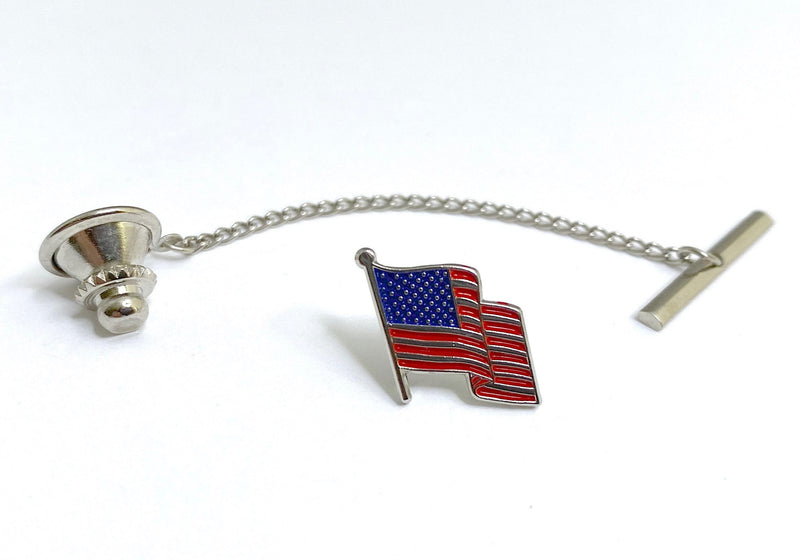 Silver American Flag  tie tack on a white background