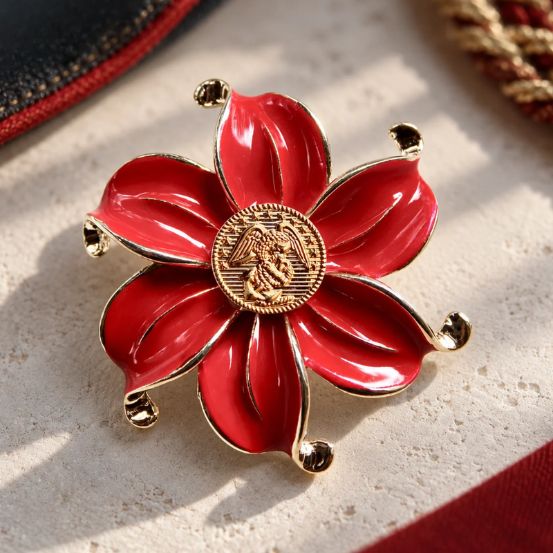 Black and Gold Brooch with Marines Red and Gold centerpiece on a white background