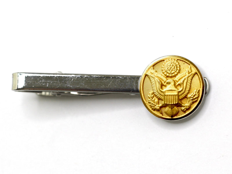 Silver tie clip with Army button on white background