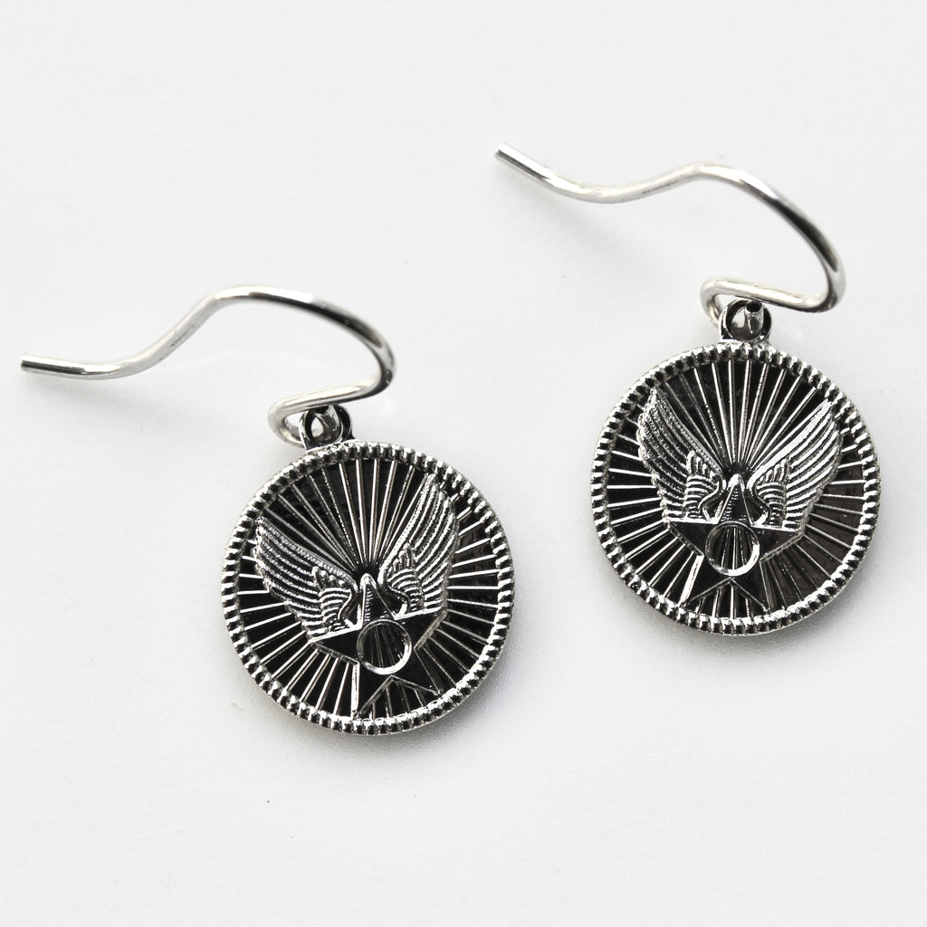 Silver eagle head earrings on a white background