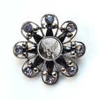 Decorative brooch with black and silver design and Air Force inspired centerpiece on a white background