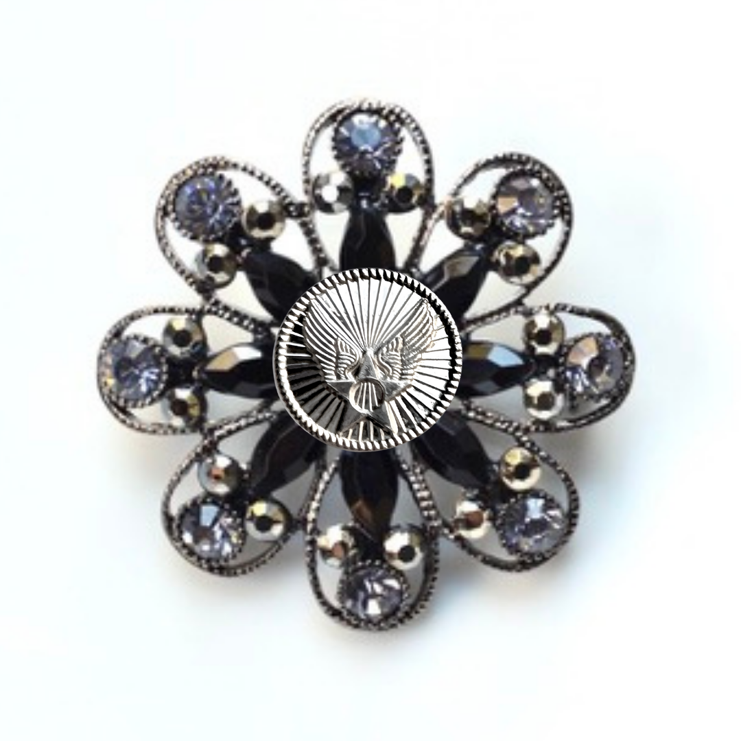 Decorative brooch with black and silver design and Air Force inspired centerpiece on a white background