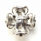 Silver four-leaf clover brooch on a white background