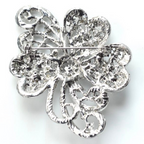Silver four-leaf clover brooch on a white background