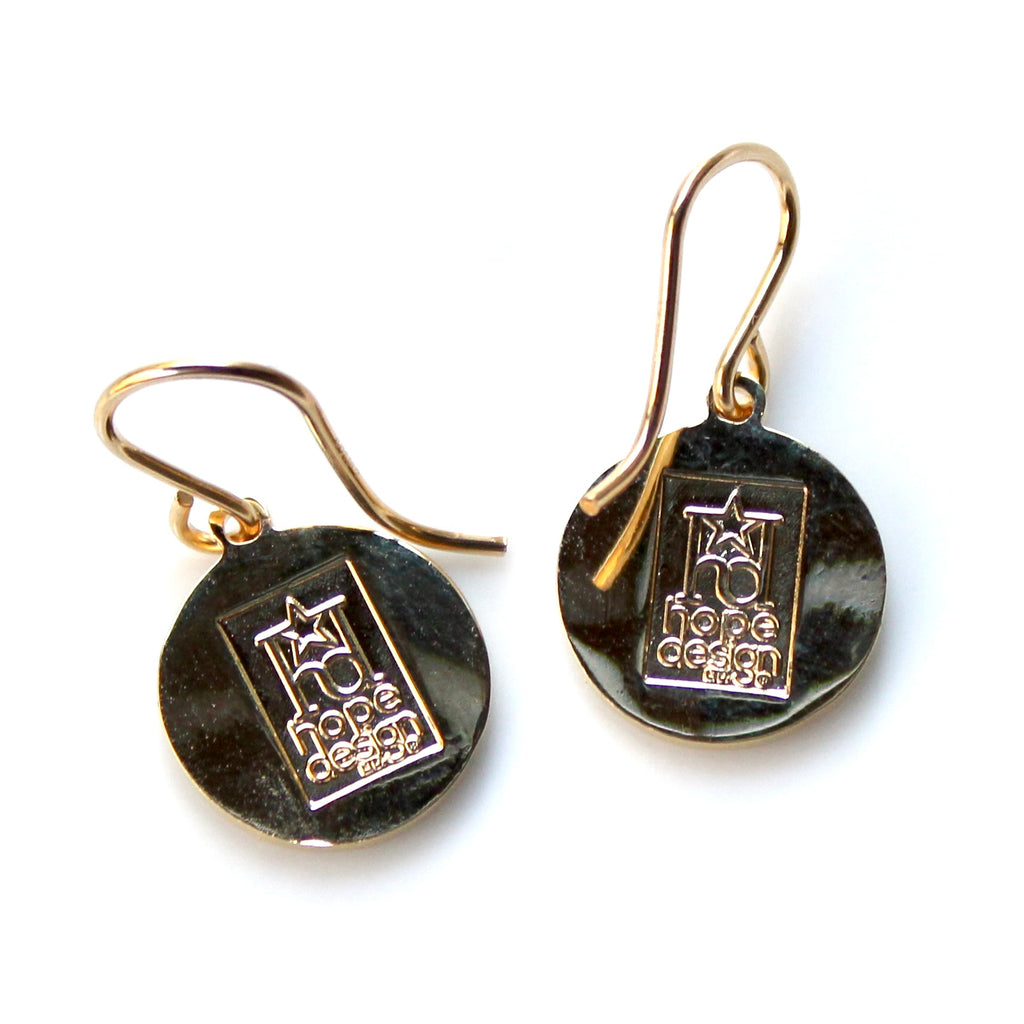 Pair of earrings with 'hope design' logo on a white background