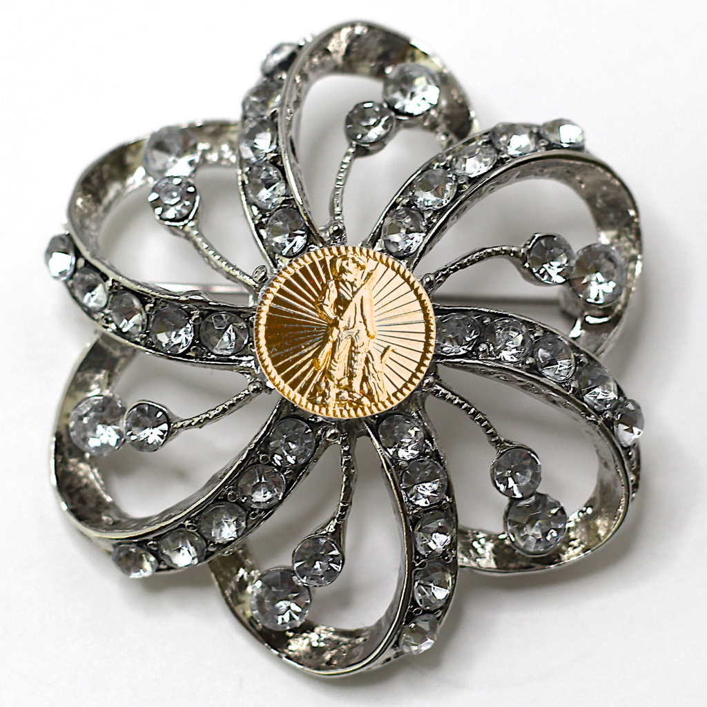 Decorative brooch with crystal-like stones and a gold National Guard center on a white background