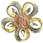 Gold brooch with crystal accents on a white background