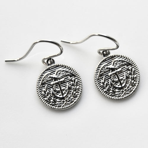 Silver anchor-themed earrings on a white background