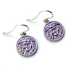 Pair of earrings with anchor design on a white background
