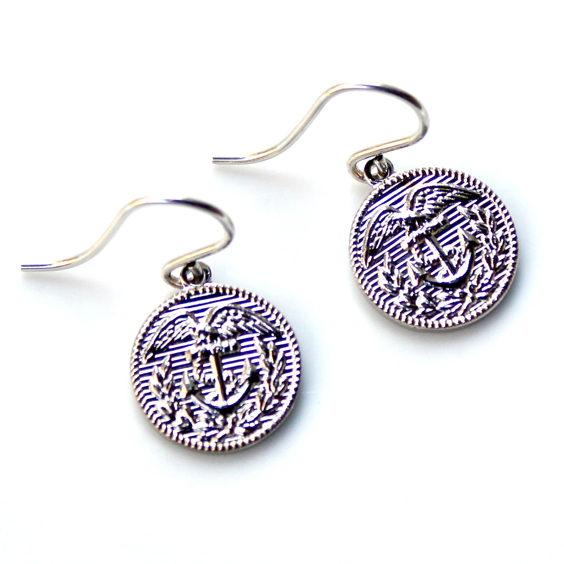 Pair of earrings with anchor design on a white background