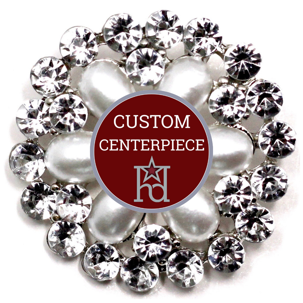 Decorative centerpiece with pearls and crystals on a white background