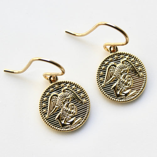 Gold angel-themed coin earrings on a white background