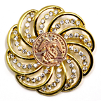 Gold brooch with gemstones and Marines inspired centerpiece on a white background