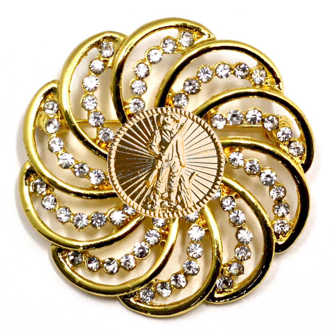 Gold brooch with National Guard design and gemstones on a white background