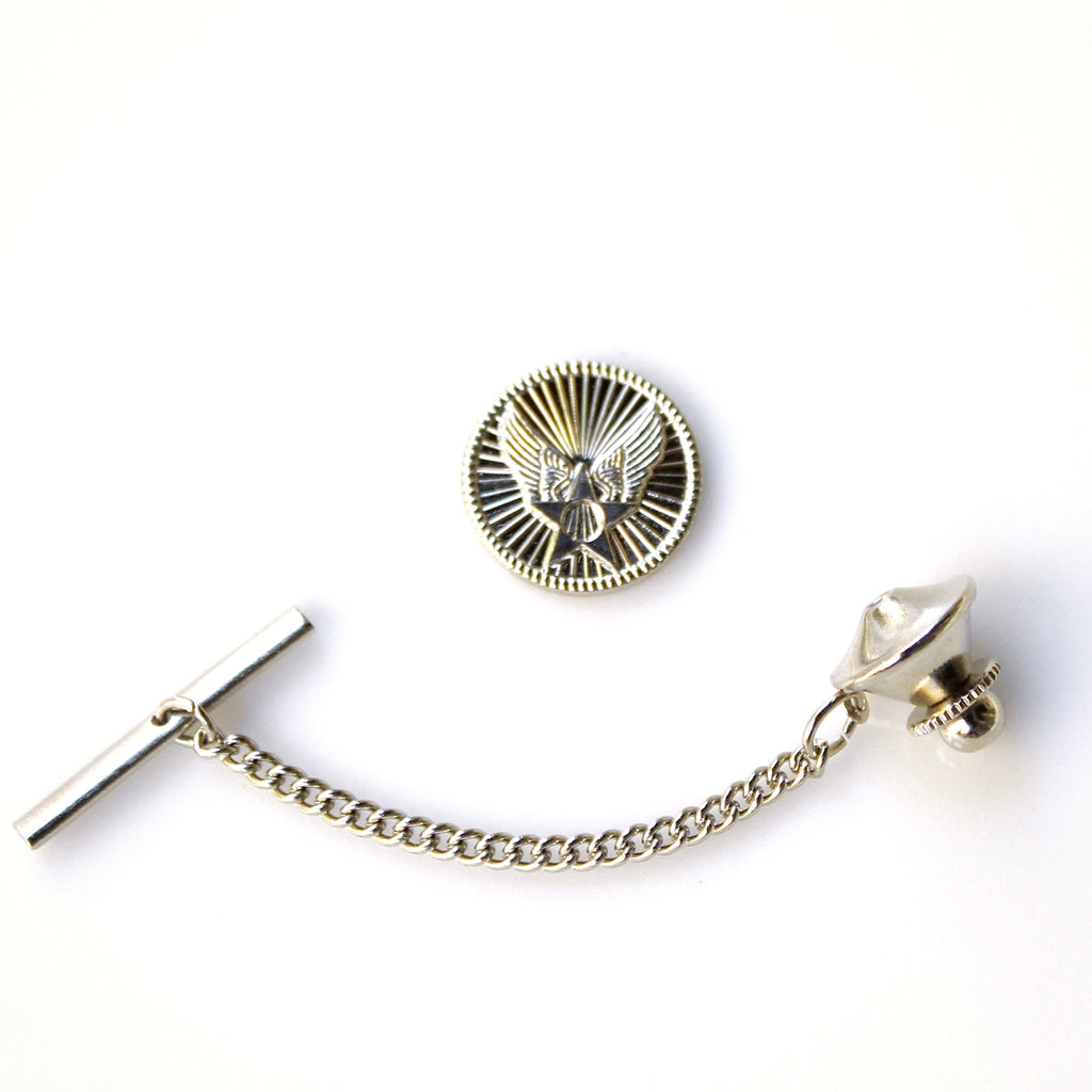 Silver tie pin with chain on a white background