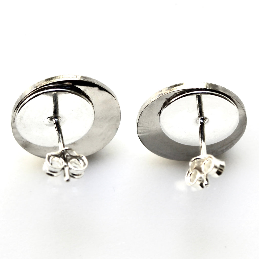 Pair of silver hoop earrings on a white background