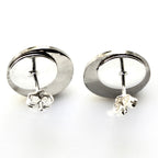 Pair of silver hoop earrings on a white background