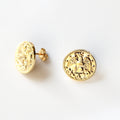 Gold coin-shaped earrings on a white background