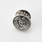 Silver emblematic badge on a white background