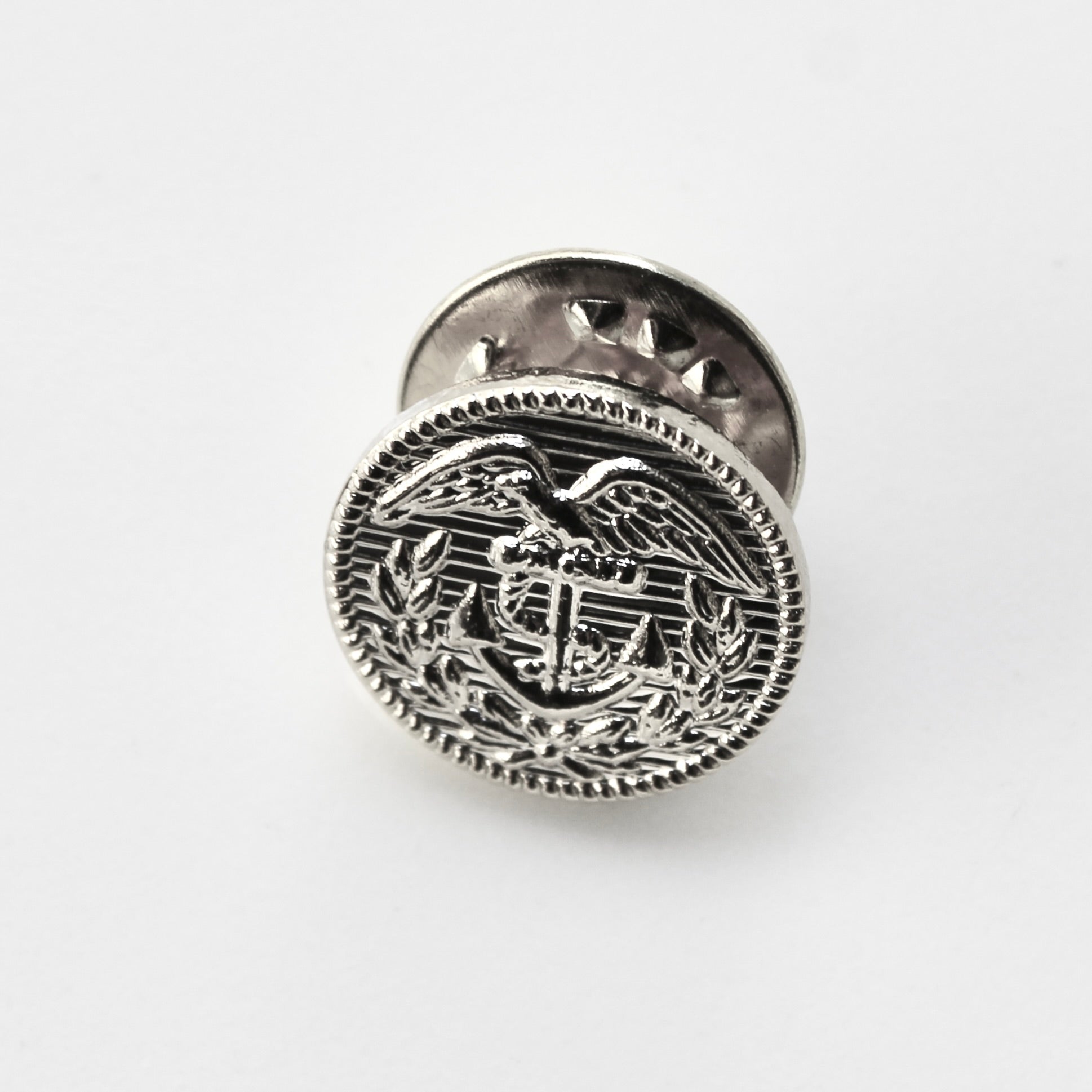 Silver emblematic badge on a white background