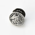 Silver metal button with eagle design on a white background
