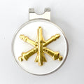A gold-colored golf hat clip featuring the Air Defense Artillery branch insignia.