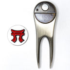 Metallic golf divot tool with a red and black logo on a white background