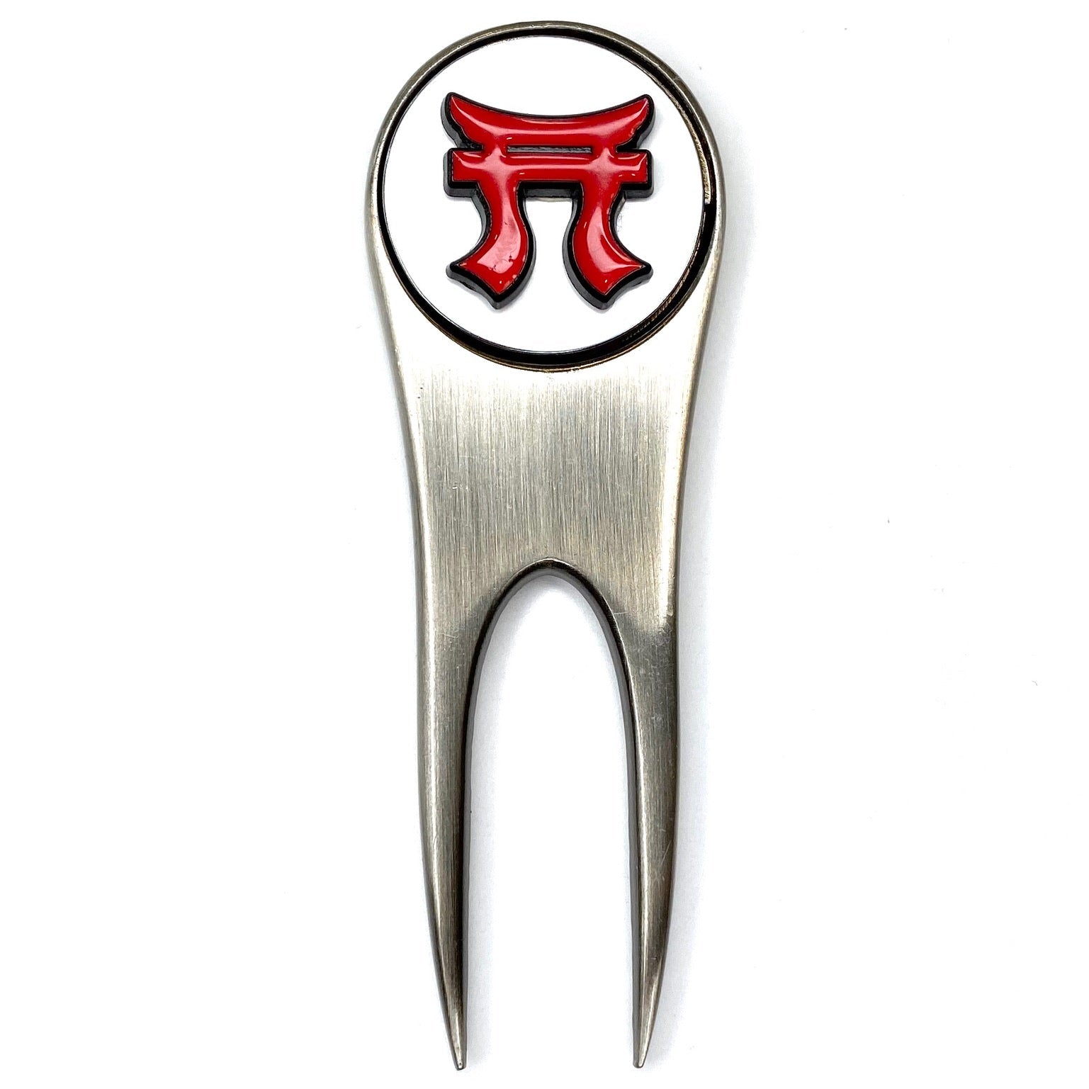 Golf divot tool with red and black emblem on a white background