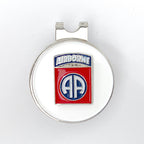 A round red, white, and blue golf hat clip with an 82nd Airborne Division centerpiece design.