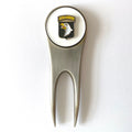 A silver golf divot tool with a magnetized ball marker featuring the 101st Airborne Division insignia, with a bald eagle design at the center.