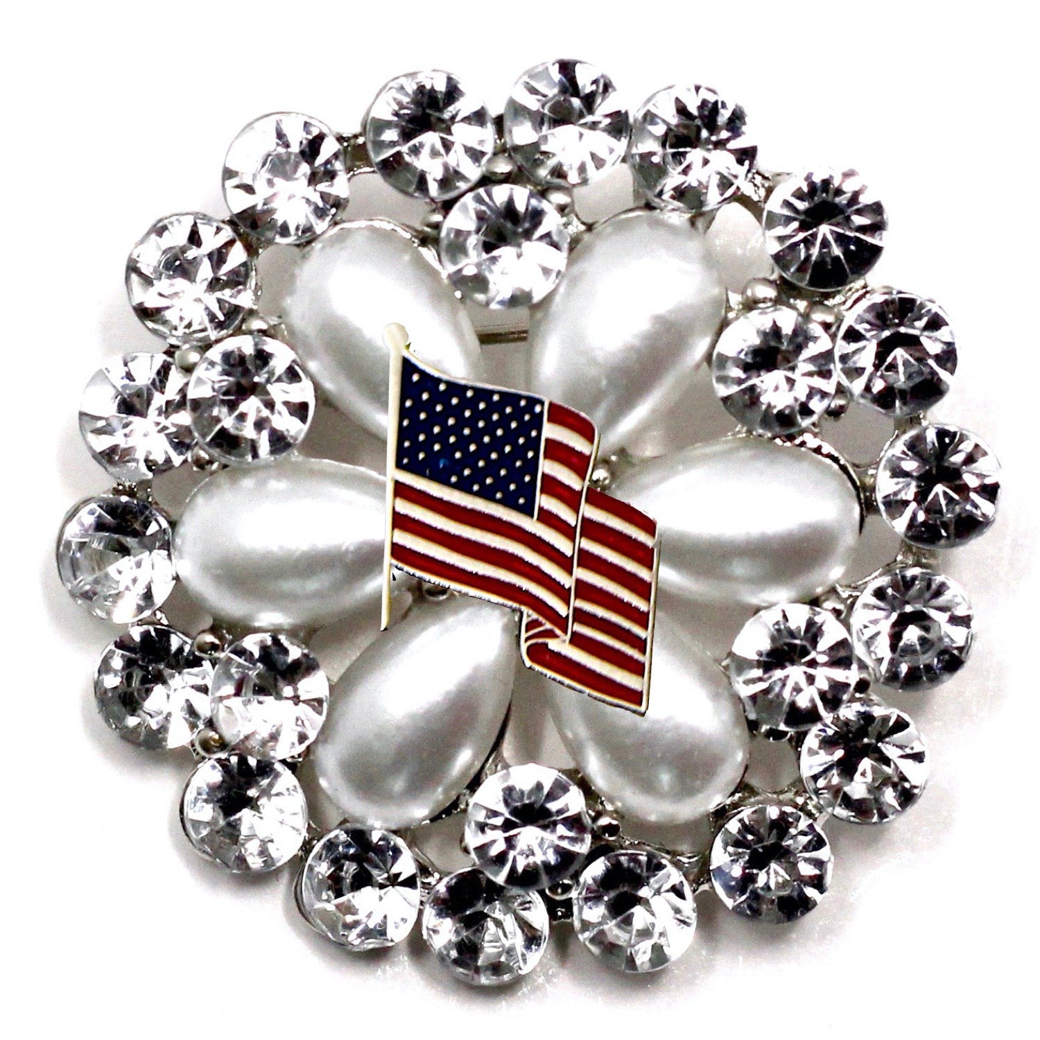 A round brooch featuring a American flag motif with crystal rhinestones.