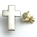 A silver-colored metal cross lapel pin with a gold-colored metal clasp.