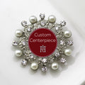 A silver brooch with faux pearls and clear crystals designed for custom centerpieces.