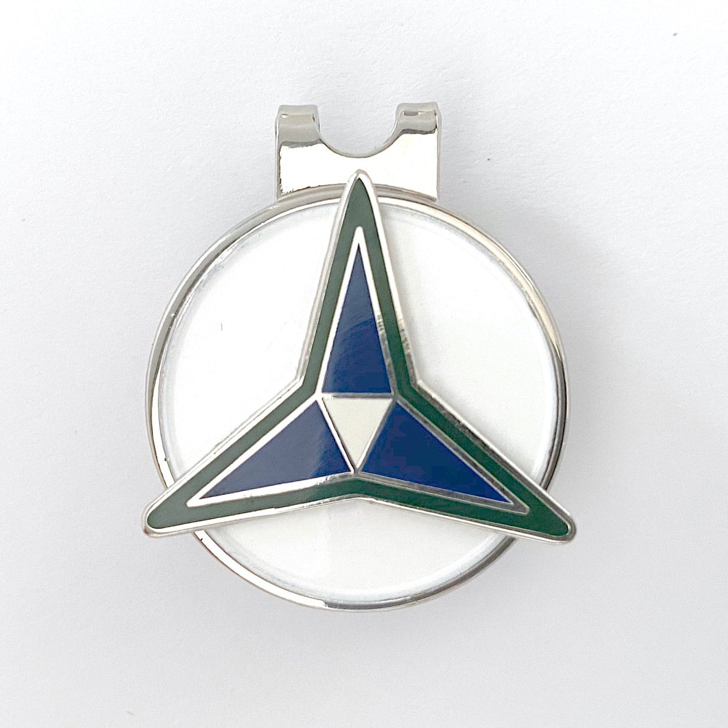 A silver golf hat clip with a blue and green III Corps centerpiece design.