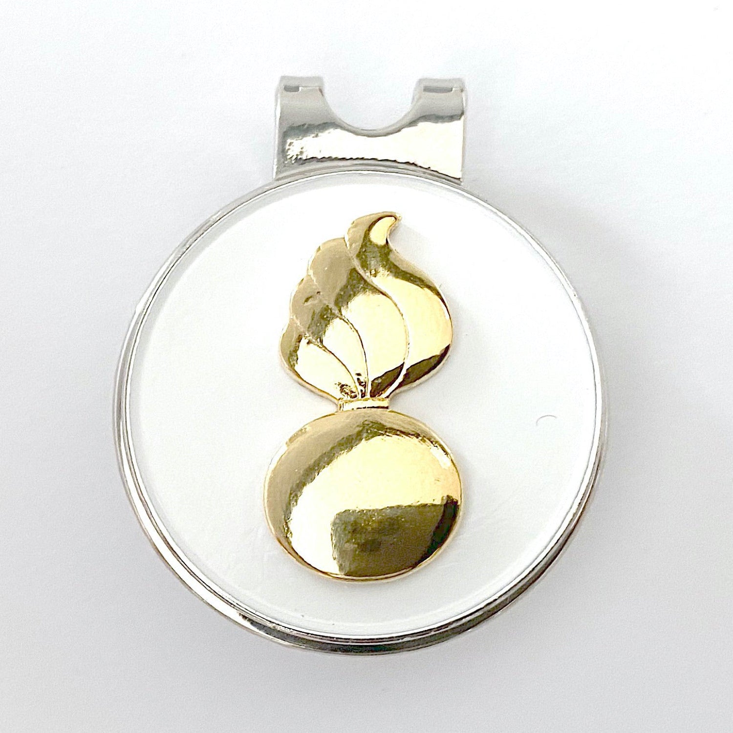 Gold pendant on a white background