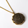 A vintage WWII era US Army uniform button necklace with gold-tone setting, displayed on a gold-plated chain with a lobster clasp.