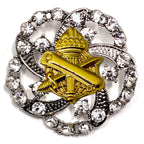 A military brooch with a gold centerpiece featuring the US Army Civil Affairs branch insignia and surrounded by crystal rhinestones.