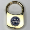 A gold-colored keychain with a 'Space Force' emblem in the center.