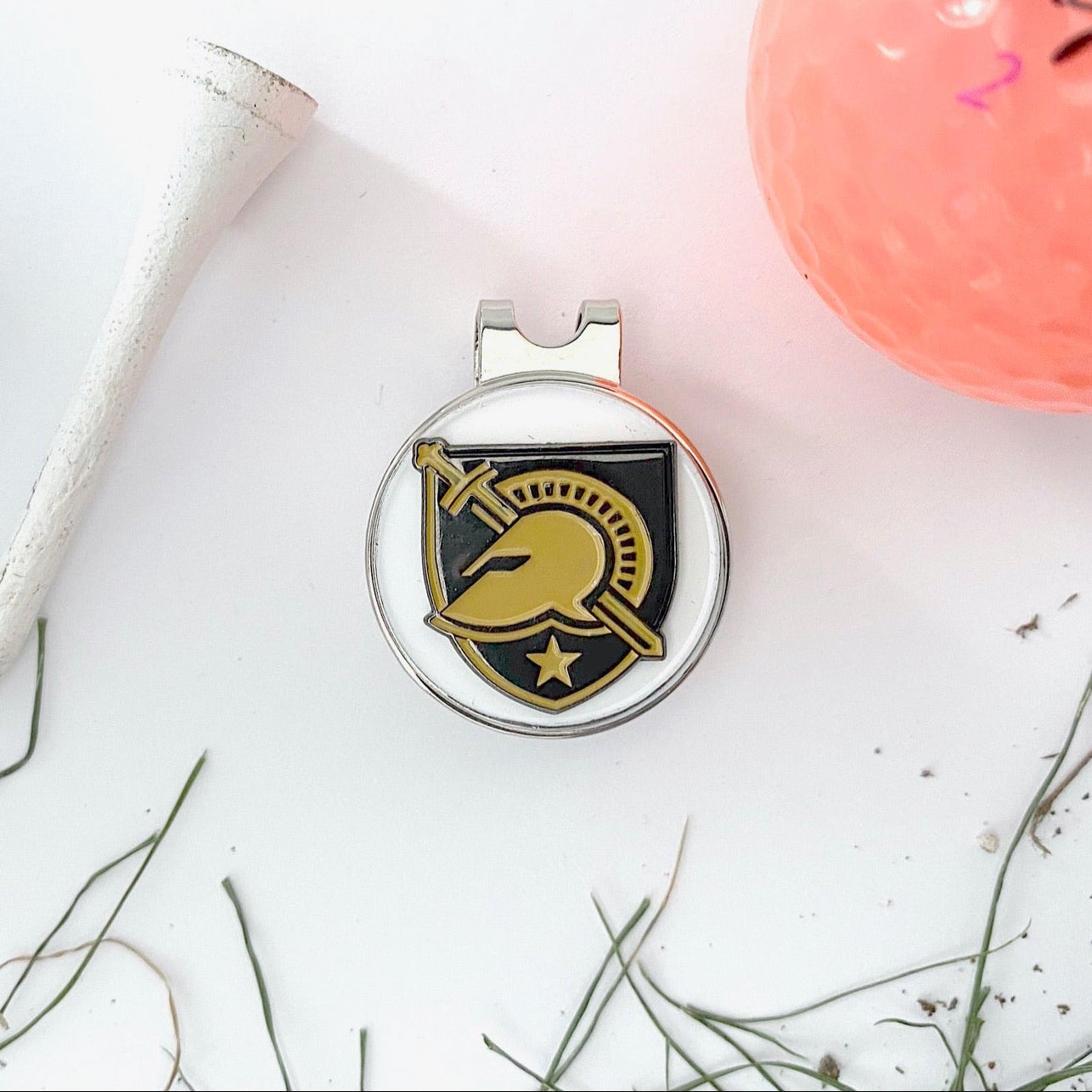 Golf ball, tee, and marker with a visible brand logo on a white background