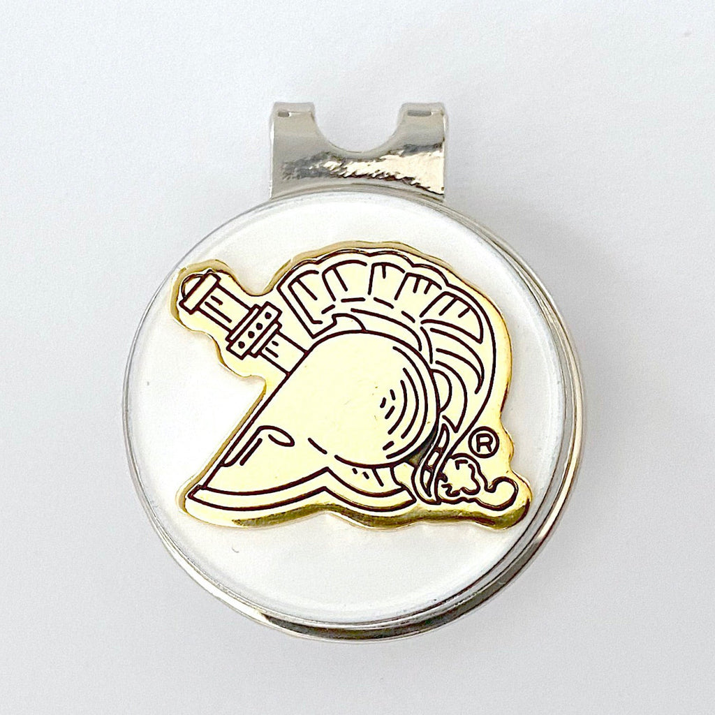 A gold-colored golf hat clip featuring an engraved representation of the United States Military Academy's Gold Athena Helmet.