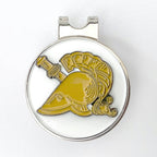 A round golf hat clip with a centerpiece of a yellow athena helmet, surrounded by a silver metallic border.