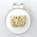 A gold-colored metal golf hat clip with a magnetic ball marker featuring the Warrant Officer insignia.