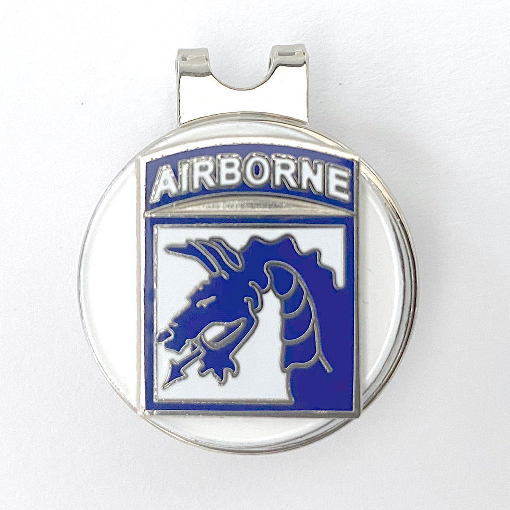 Metallic badge with 'Airborne' text and emblem on a white background
