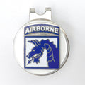 Metallic badge with 'Airborne' text and emblem on a white background